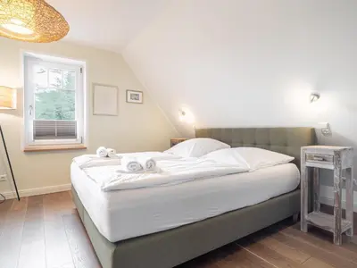 Ein Bett oder Betten in einem Zimmer der Unterkunft UNS VAGELHUS