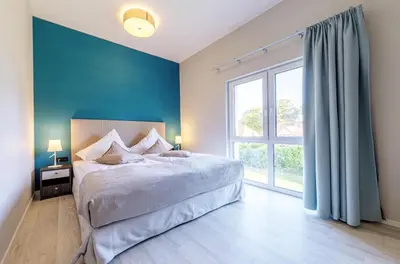 Ein Bett oder Betten in einem Zimmer der Unterkunft Seeräuber - Stilvolle 4-Zimmer-Wohnung mit Ostbalkon & Platz für 8 Gäste