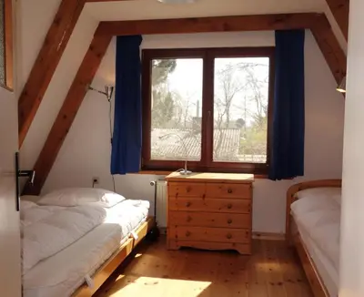 Ein Bett oder Betten in einem Zimmer der Unterkunft Ferienhaus-Fischlandde Grünbaum Ahrenshoop