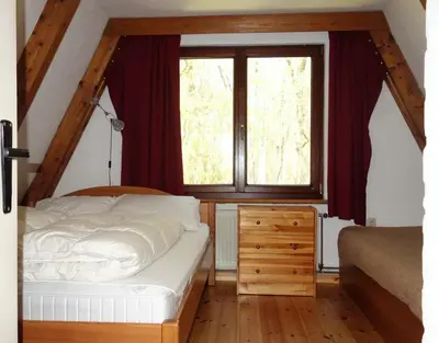 Ein Bett oder Betten in einem Zimmer der Unterkunft Ferienhaus-Fischlandde Grünbaum Ahrenshoop