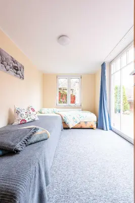 Ein Bett oder Betten in einem Zimmer der Unterkunft Ferienhaus Windrose