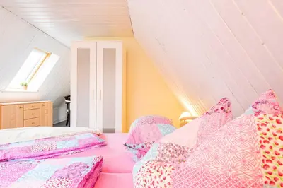 Ein Bett oder Betten in einem Zimmer der Unterkunft Ferienhaus Windrose