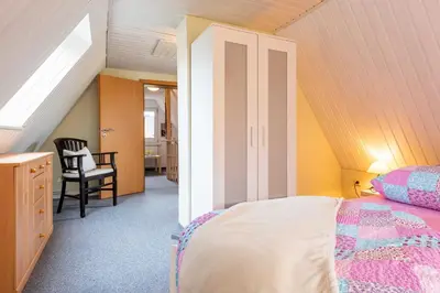 Ein Bett oder Betten in einem Zimmer der Unterkunft Ferienhaus Windrose