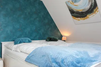 Ein Bett oder Betten in einem Zimmer der Unterkunft Freiraum Prerow