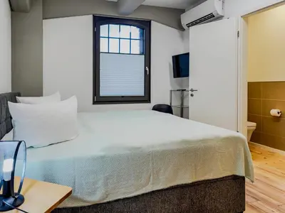 Ein Bett oder Betten in einem Zimmer der Unterkunft Speicherresidenz App 3 1 - Wasserblick