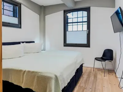 Ein Bett oder Betten in einem Zimmer der Unterkunft Speicherresidenz App 3 1 - Wasserblick