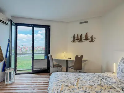 Ein Bett oder Betten in einem Zimmer der Unterkunft Speicherresidenz App 3 7 - Hafenblick
