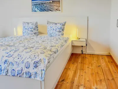 Ein Bett oder Betten in einem Zimmer der Unterkunft Speicherresidenz App 3 7 - Hafenblick