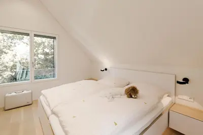 Ein Bett oder Betten in einem Zimmer der Unterkunft Quartier Wieck9