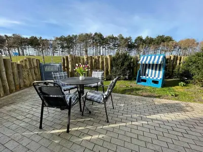 Ein Garten an der Unterkunft Strandwohnung direkt am Meer - Whg 32