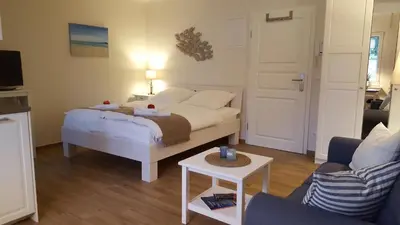 Ein Bett oder Betten in einem Zimmer der Unterkunft Appartementhaus Zingst 5 - Urlaub zwischen Meer & Bodden
