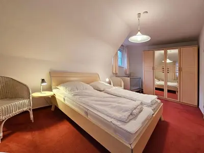 Ein Bett oder Betten in einem Zimmer der Unterkunft Dat smucke Huus