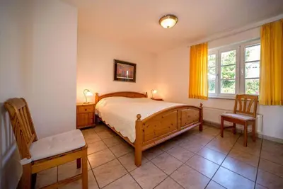 Ein Bett oder Betten in einem Zimmer der Unterkunft Rüm Hart