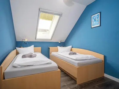 Ein Bett oder Betten in einem Zimmer der Unterkunft Residenz am Strand Wohnung 3-55
