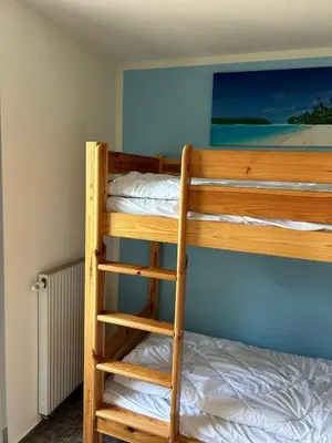 Ein Bett oder Betten in einem Zimmer der Unterkunft Sünnenkringel 36
