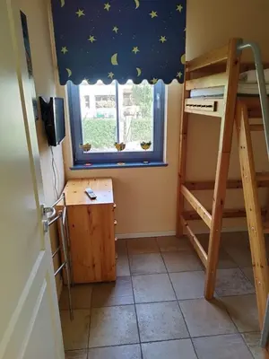 Ein Bett oder Betten in einem Zimmer der Unterkunft Utkiek 1
