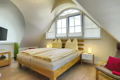 Ein Bett oder Betten in einem Zimmer der Unterkunft caraL - Die Familienferienwohnung in Zingst
