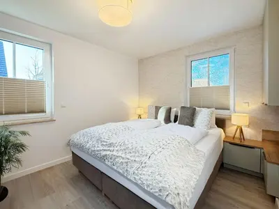 Ein Bett oder Betten in einem Zimmer der Unterkunft Küstenzauber