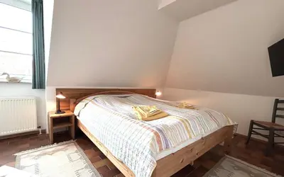 Ein Bett oder Betten in einem Zimmer der Unterkunft Resi Q7
