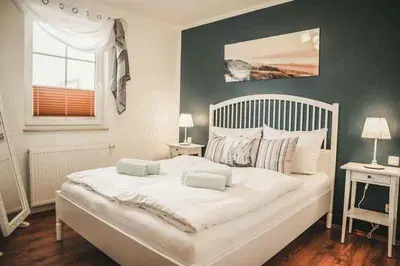 Ein Bett oder Betten in einem Zimmer der Unterkunft Bucht 9