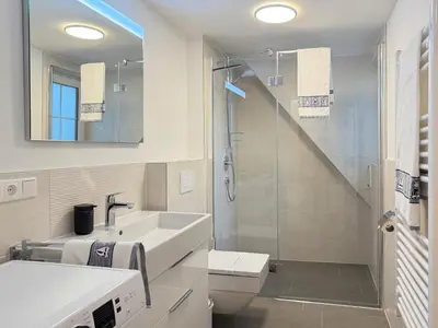 Ein Badezimmer in der Unterkunft Dünenläufer Whg 6