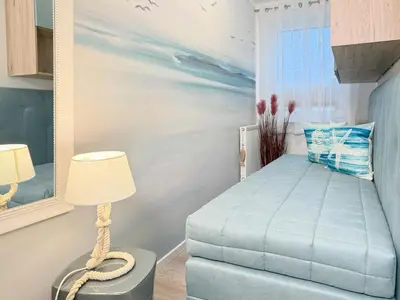 Ein Bett oder Betten in einem Zimmer der Unterkunft Dünenläufer Whg 6