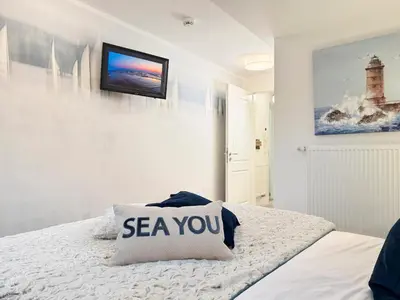 Ein Bett oder Betten in einem Zimmer der Unterkunft Dünenläufer Whg 6