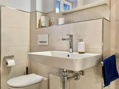 Ein Badezimmer in der Unterkunft Achtern Diek 12b - Wohnung 5