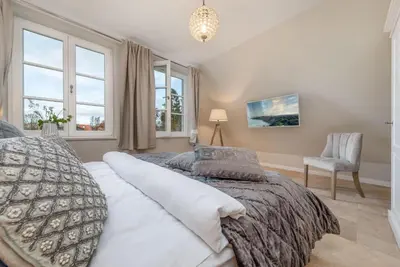 Ein Bett oder Betten in einem Zimmer der Unterkunft Zingst Deluxe