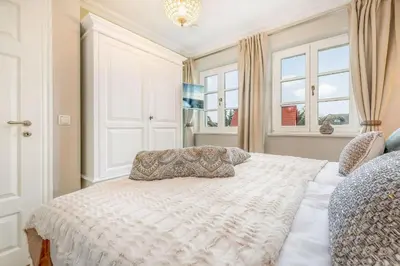 Ein Bett oder Betten in einem Zimmer der Unterkunft Zingst Deluxe