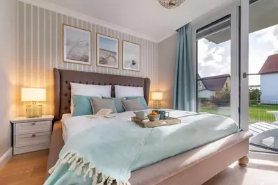 Ein Bett oder Betten in einem Zimmer der Unterkunft Suite Seablue