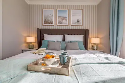 Ein Bett oder Betten in einem Zimmer der Unterkunft Suite Seablue