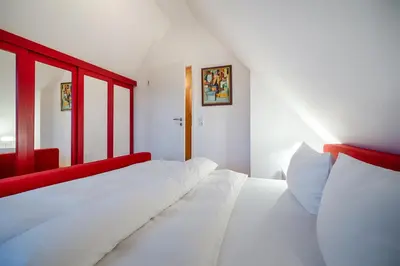 Ein Bett oder Betten in einem Zimmer der Unterkunft Dünengras