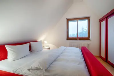 Ein Bett oder Betten in einem Zimmer der Unterkunft Dünengras