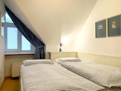 Ein Bett oder Betten in einem Zimmer der Unterkunft Kapitänsgarten W13 Roth