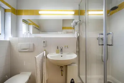 Ein Badezimmer in der Unterkunft Trident Wohnung 2