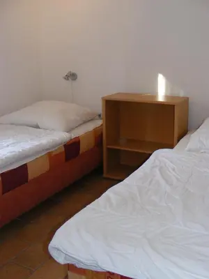 Ein Bett oder Betten in einem Zimmer der Unterkunft Waldsiedlung 18 Haus 12 Wo 1