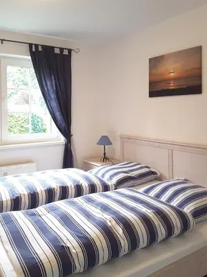 Ein Bett oder Betten in einem Zimmer der Unterkunft Mühlenpark 2 Mühlenpark Haus B Wo 6