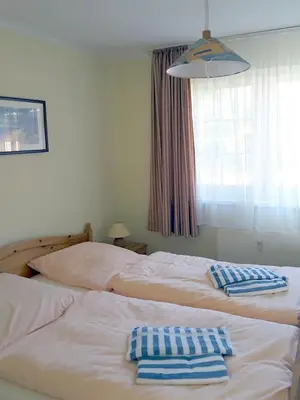 Ein Bett oder Betten in einem Zimmer der Unterkunft Mühlenpark 2 Mühlenpark Haus B Wo 8