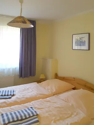 Ein Bett oder Betten in einem Zimmer der Unterkunft Mühlenpark 2 Mühlenpark Haus B Wo 8