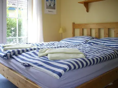 Ein Bett oder Betten in einem Zimmer der Unterkunft Mühlenpark 2 Mühlenpark Haus B Wo 7