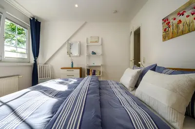 Ein Bett oder Betten in einem Zimmer der Unterkunft Mühlenpark 1 Mühlenpark Haus 3 Wo 12