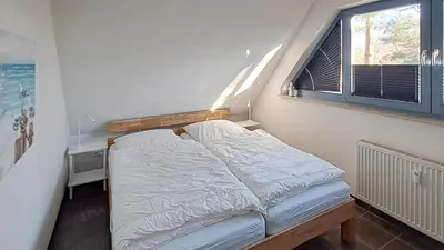 Ein Bett oder Betten in einem Zimmer der Unterkunft Haus Kranich Wo 15