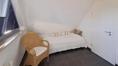 Ein Bett oder Betten in einem Zimmer der Unterkunft Haus Kranich Wo 15