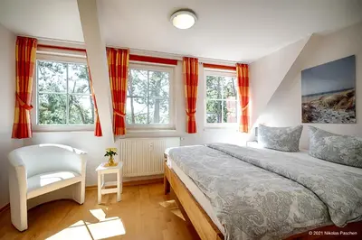 Ein Bett oder Betten in einem Zimmer der Unterkunft Strandsüchtig