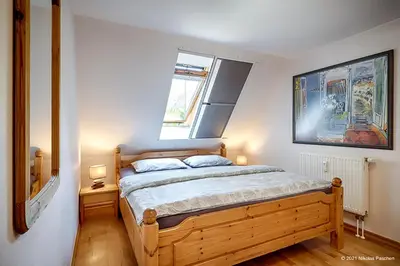 Ein Bett oder Betten in einem Zimmer der Unterkunft Strandsüchtig