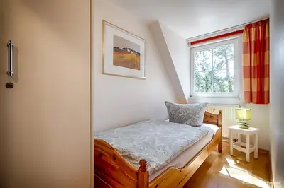 Ein Bett oder Betten in einem Zimmer der Unterkunft Strandsüchtig