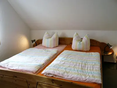 Ein Bett oder Betten in einem Zimmer der Unterkunft Haus Anna