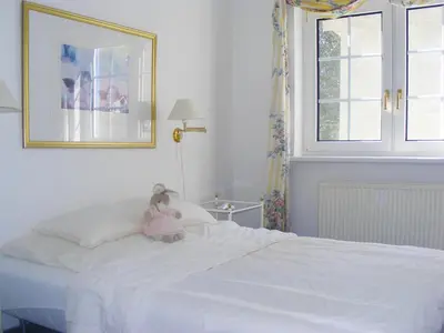 Ein Bett oder Betten in einem Zimmer der Unterkunft Hafenkoje Wo 2