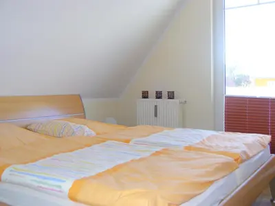 Ein Bett oder Betten in einem Zimmer der Unterkunft Haus am Brunnen Haus 